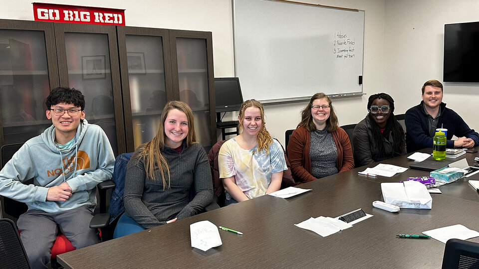 Group photo of students with Logan Perry